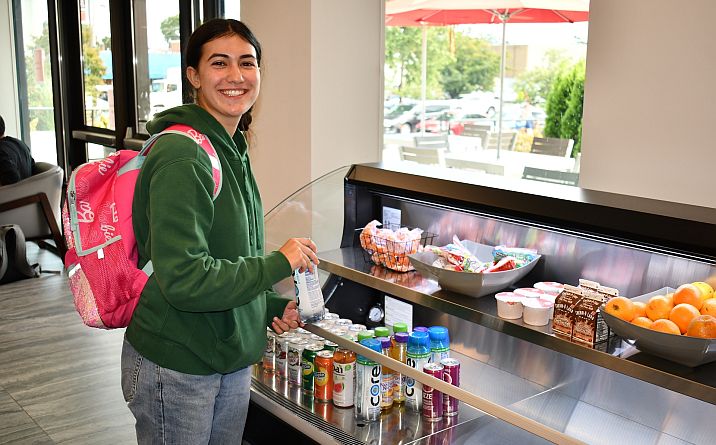 student at beverage counter